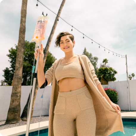 Girl getting IV Therapy by the pool